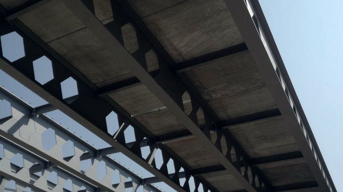 Underside of fabricated cellular steel beams supporting a concrete deck